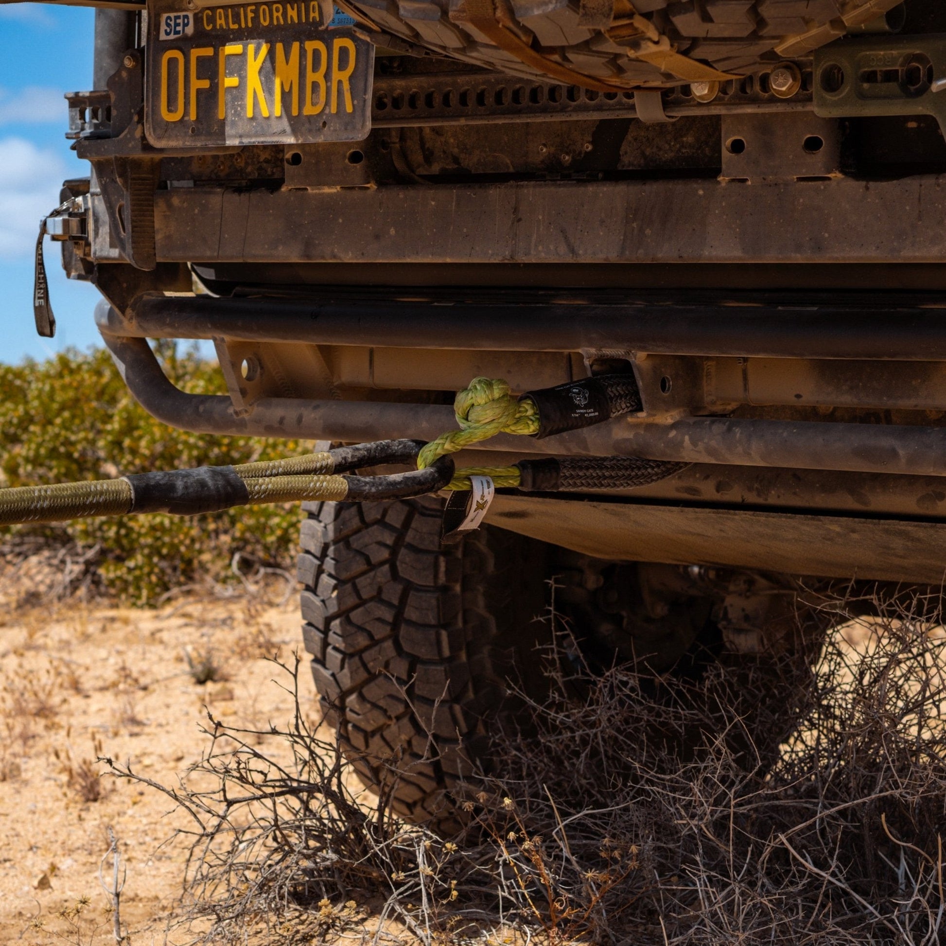 Close-up of Kinetic-X Hitch Hero soft shackle connected to rear hitch receiver during off-road recovery in the desert using a static bridle and kinetic rope.